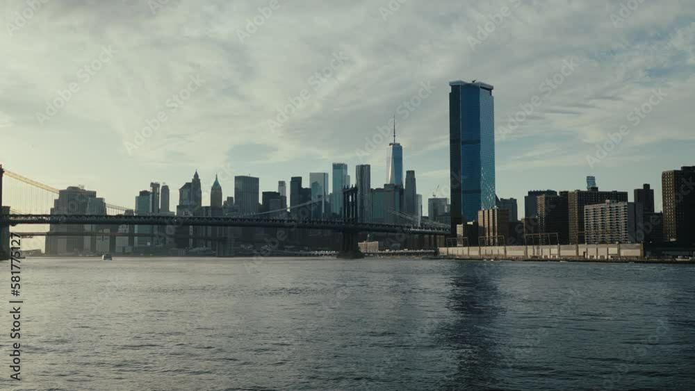 Brooklyn bridge and lower Manhattan tracking shot on sunset, New York Brooklyn bridge and lower Manhattan tracking shot on sunset, New York