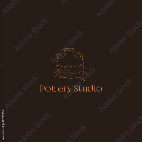 Pottery Studio Logo. Hand drawn pot on the hand on the dark background.