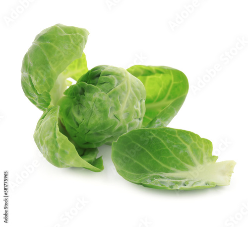 Fresh green brussels sprout and leaves on white background