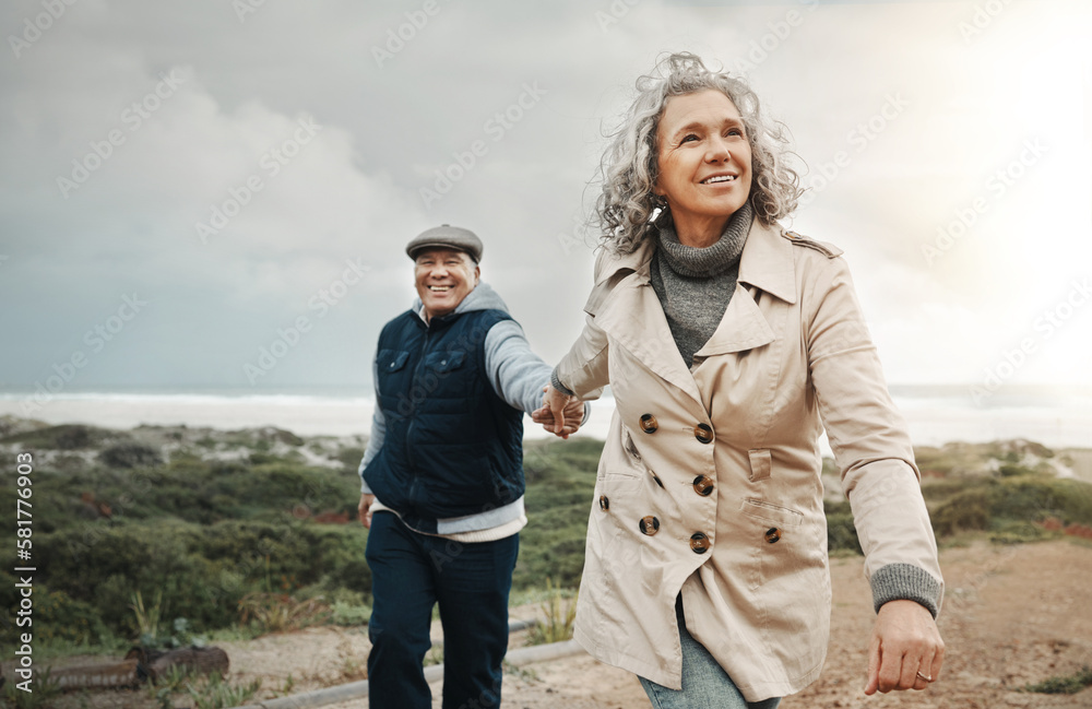 Fototapeta premium Beach, love and senior couple holding hands on romantic evening walk in nature on happy date. Smile, romance and retirement, old woman and man walking on ocean path at sunset on holiday in Australia.