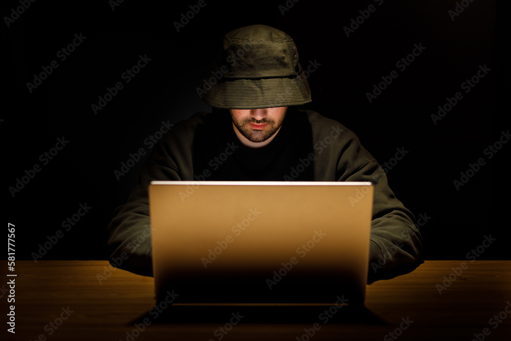 Payments System Hacking. Online Credit Cards Payment Security Concept. Hacker in Black. Hacking the System Payments System Hacking. Online Credit Cards Payment Security Concept. Hacker in Black. Hacking the System