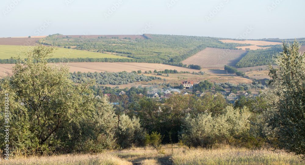 Naklejka premium Landscapes of the Northern regions of Moldova. A pastoral panorama with nature. Moldovan villages and houses and streets.