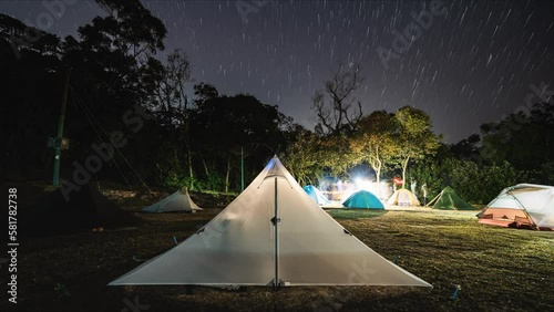 Night lapse of starry sky over busy campsite, Cheung Sheung Sai Kung Hong Kong photo