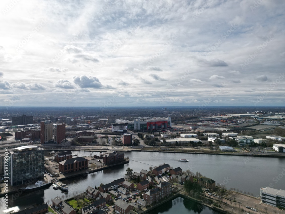 Aerial view of modern buildings and landmarks next to the river. Taken in Salford Quays England. 