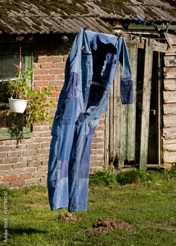 Overall on washingline drying. Farmer. Zuidwolde Drenthe Netherlands.  photo