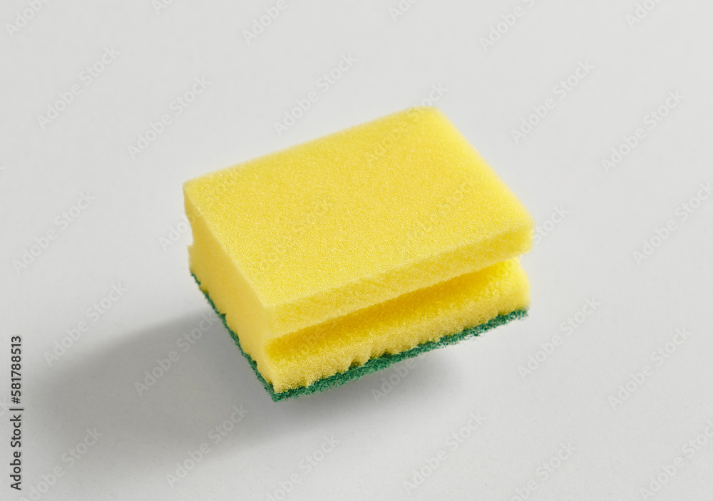 Kitchen dish sponge yellow and green isolated white background. Kitchen dish sponge yellow and green isolated white background.