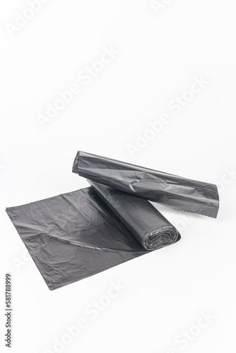 Black plastic garbage bags isolated on white background  clipping path included.