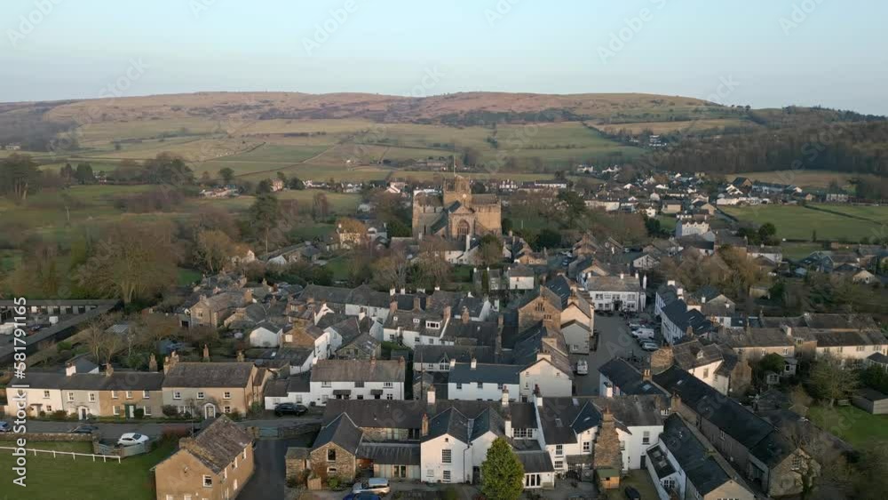 Slow Motion clip of the Cumbrian medieval village of Cartmel showing the historic Cartmel Priory at sunset on a winters day. Slow Motion clip of the Cumbrian medieval village of Cartmel showing the historic Cartmel Priory at sunset on a winters day.