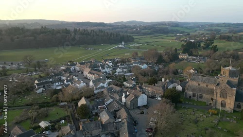 Slow Motion clip of the Cumbrian medieval village of Cartmel showing the historic Cartmel Priory at sunset on a winters day. photo