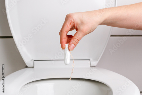 someone throws a tampon down the toilet