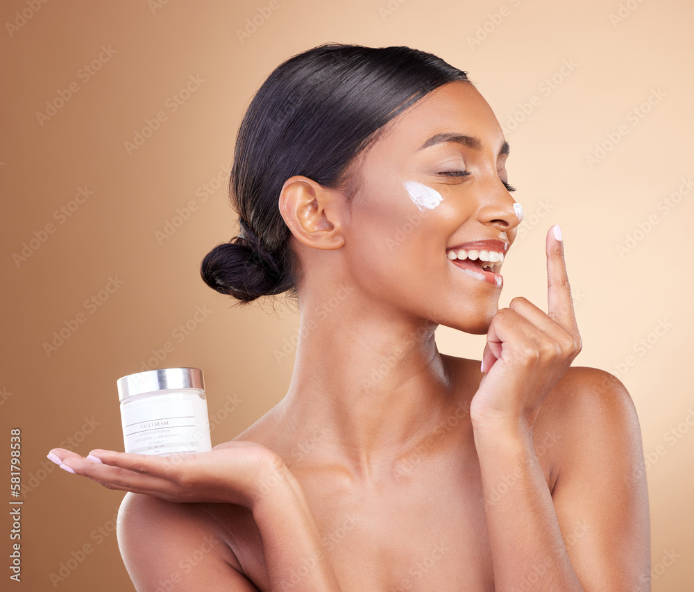 Woman, face and smile with moisturizer cream for beauty skincare cosmetics, self love or care against a studio background. Happy female smiling for lotion, moisturizing creme or facial treatment - obrazy, fototapety, plakaty 