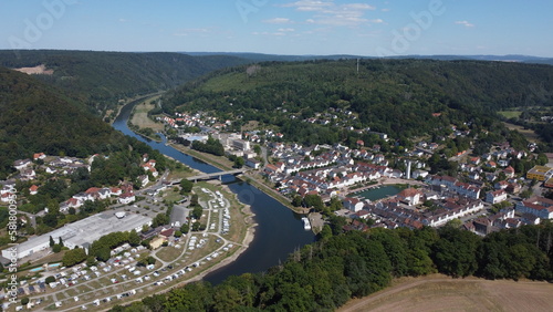Aerial drone view of the small German village called Bad Karlshafen. Old white European buildings in a touristy town on the river Wezer.
