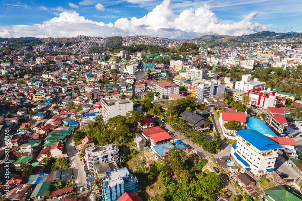 Baguio City, Philippines - Afternoon aerial of the skyline of the city extending up to the hills.