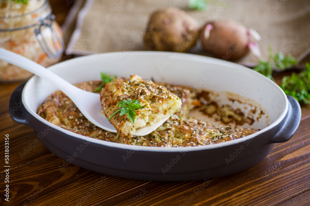 potato casserole with cabbage and spices in a ceramic form potato casserole with cabbage and spices in a ceramic form