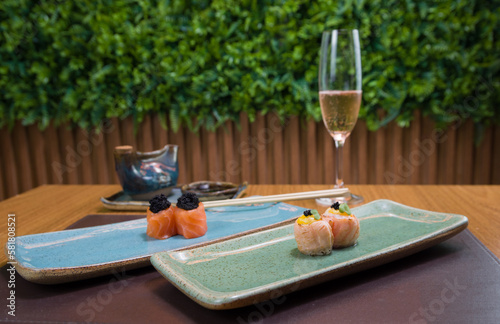 Differents japanese sushi on a elegant blue plate.