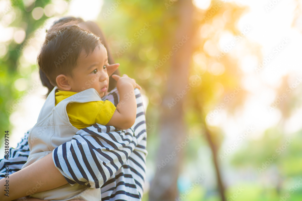 Mom hold toddler baby boy recreation in park Mom hold toddler baby boy recreation in park