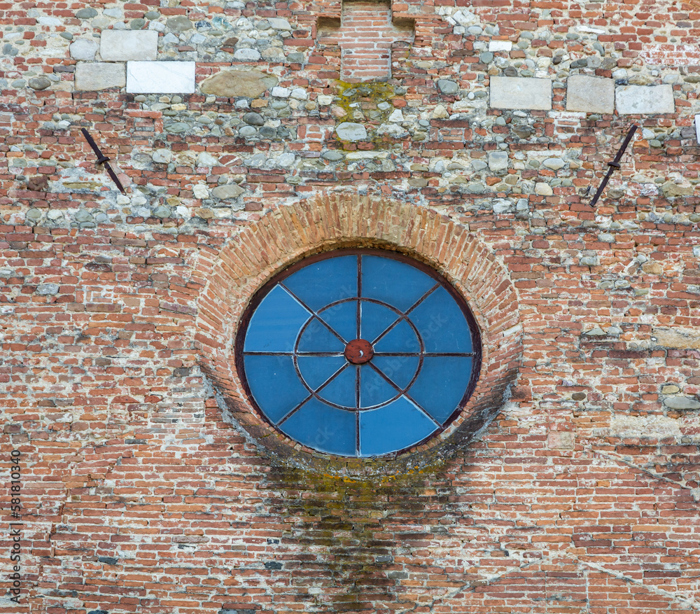Round window of the ancient church of San Michele Arcangelo in Antraccoli, Lucca, Tuscany region, central Italy - 12th century