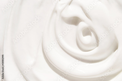 Cosmetic swirl product background. White toothpaste texture. Cleansing face emultion. Milk liquid sunscreen. Closeup hydrating cream. Abstract makeup lotion swatch. Beauty spa foam