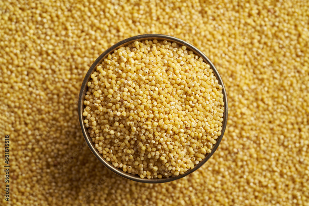 Dry peeled millet in a bowl, top view