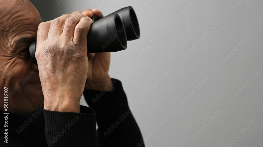 looking through binoculars with white background with people stock photo looking through binoculars with white background with people stock photo