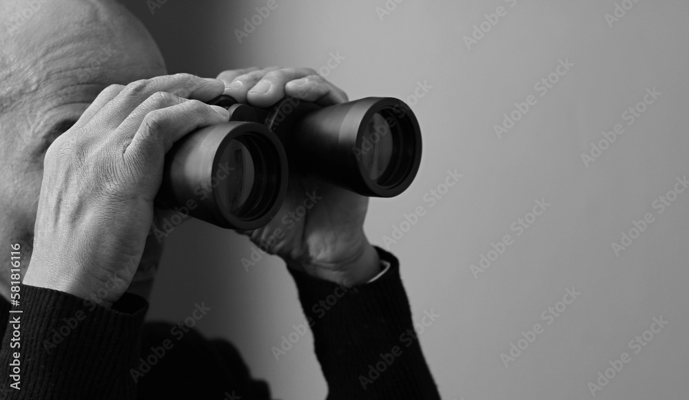 looking through binoculars with white background with people stock photo