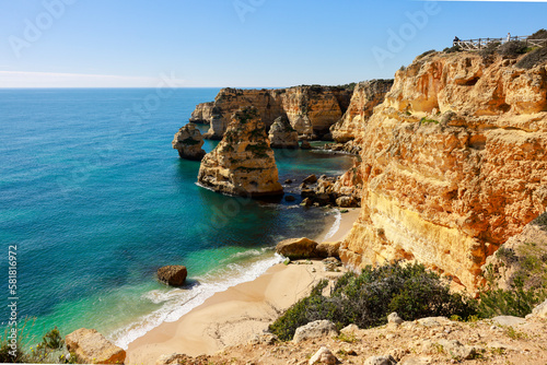 Fototapeta Naklejka Na Ścianę i Meble -  Beautiful cliffs and rock formations at Marinha Beach in Algarve, Portugal