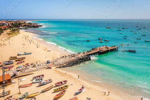Pier and boats on turquoise water in city of Santa Maria, Sal, Cape Verde © malajscy