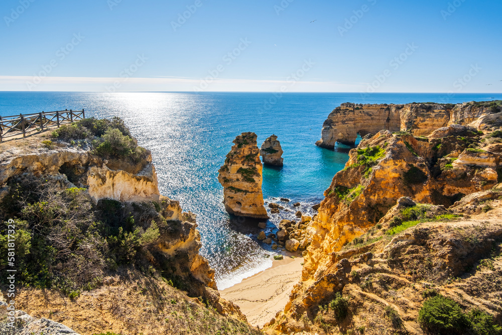 Fototapeta premium Beautiful cliffs and rock formations at Marinha Beach in Algarve, Portugal