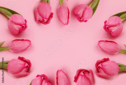 Greeting card or wedding invitation. Frame of pink tulips on pastel pink background. Waiting for spring. Flower composition. Happy Mother's Day. Top view, Copy Space #581818184