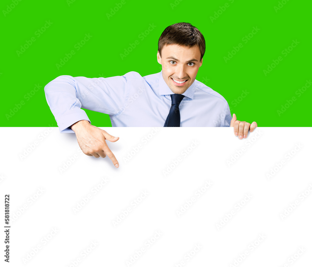 Portrait image of business man professional bank manager in confident cloth. Businessman stand behind, hang over, show point finger empty white banner signboard. Isolate green chroma key background