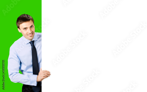 Portrait image of business man professional bank manager in confident cloth, necktie stand behind show empty white banner signboard billboard with copy space area. Isolate green chroma key background.