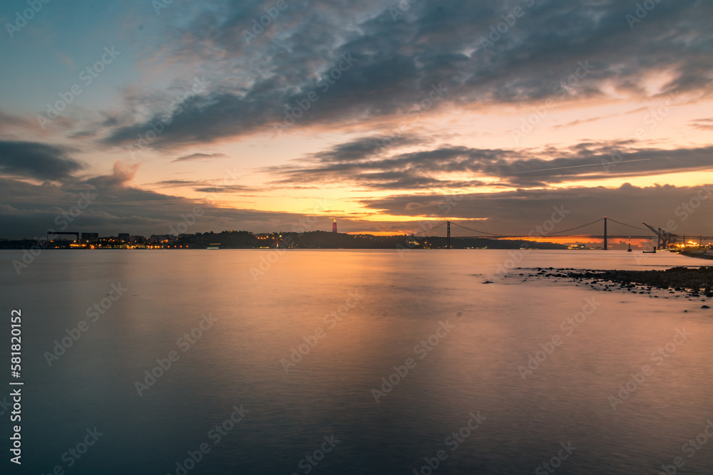 Amazing sunset over the River Tagus in Lisbon, Portugal.