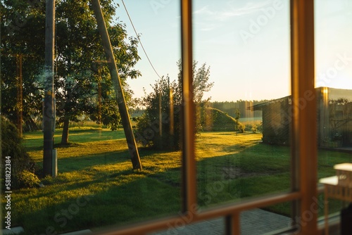 Golden sunrise view of the garden from the house