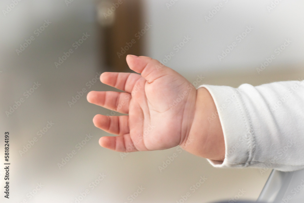 Naklejka premium Baby's hand gesturing. Stock Photo.