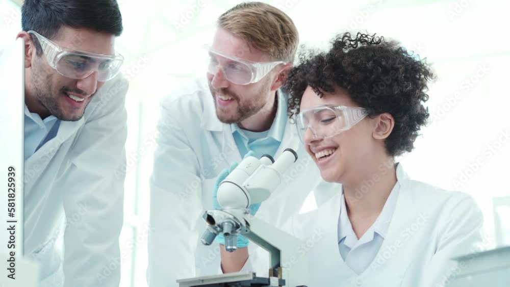 group of scientists discussing the results of their research. group of scientists discussing the results of their research.