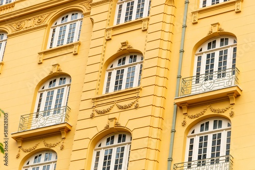 Low angle shot of an ancient yellow building with fancy exterior design in downtown Rio de Janeiro