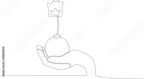 A hand holding a bomb. Anti-terrorism day one line drawing