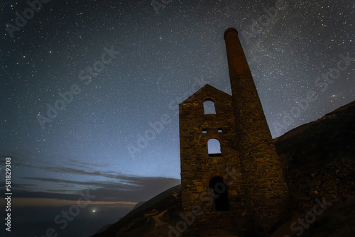 Towanroath tin mine engine house at night with the stars and galaxy behind it