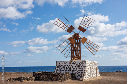 Windmill near the village of Puerto Lajas on Fuerteventura Island photo