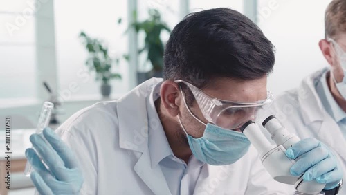 scientist examining liquid samples in the laboratory.