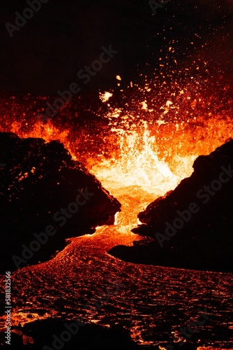 Vertical shot of lava flowing over rocky surface during 2022 Meradalir volcano eruption, Iceland