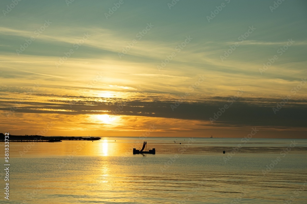 Beautiful view of an orange sunset on a calm sea Beautiful view of an orange sunset on a calm sea
