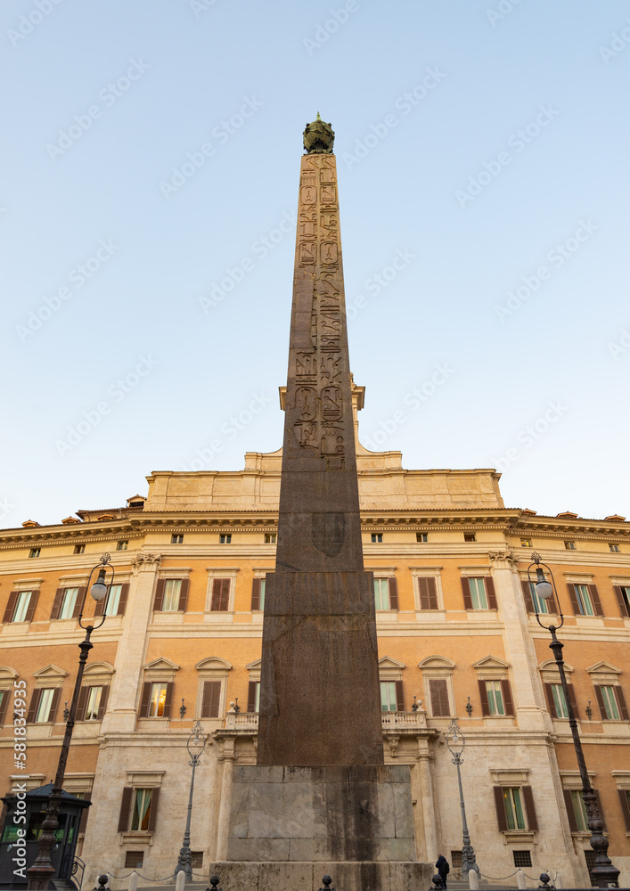 Egyptian obelisk with hieroglyphic text in the famous square of 