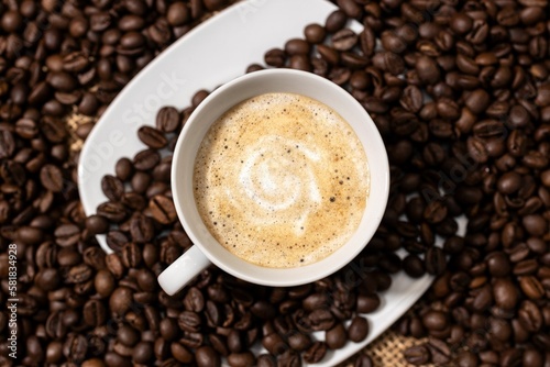 Top view of Coffee late cup and roasted beans