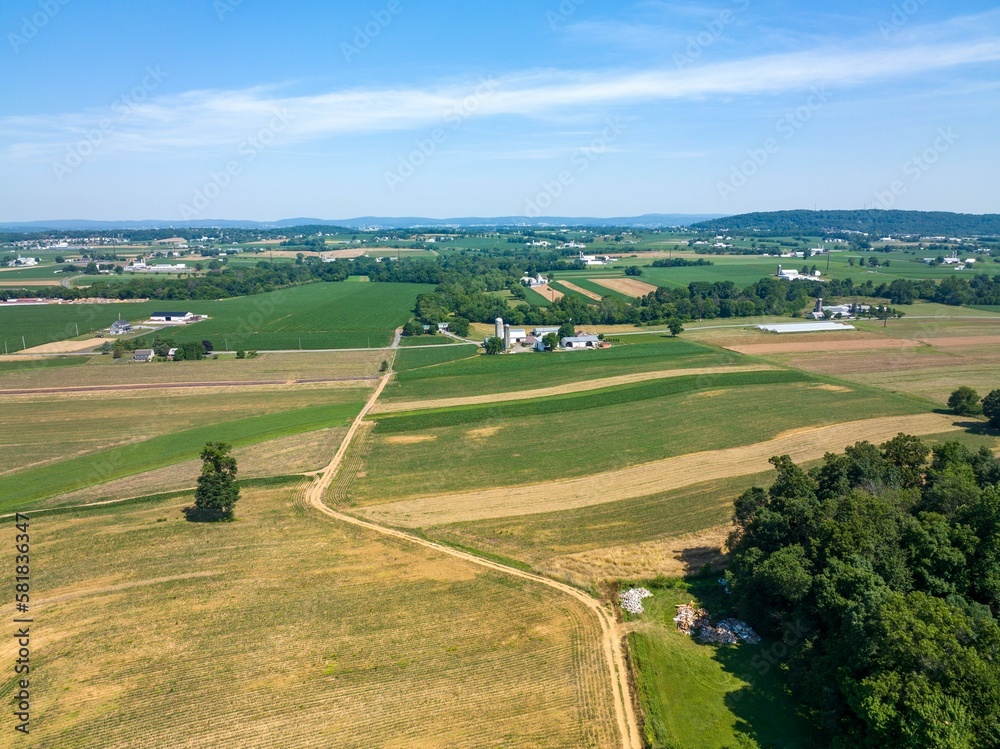 Aerial view of a countryside area with fields and houses
