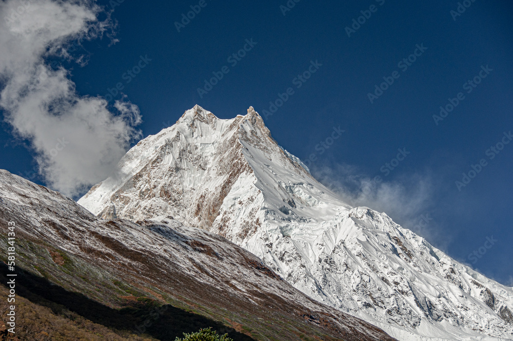 View of Manaslu mountain Main Summit and its East Pinnacle peak, as seen from the trail to Samagaon village, Manaslu Circuit trek, Gorkha district, Nepal Himalayas, Nepal