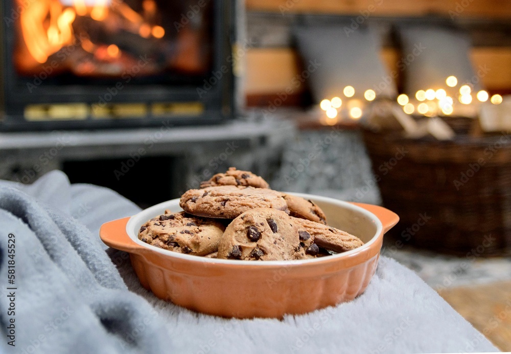 Fototapeta premium Chocolate chip cookies with Christmas decorations in the background.