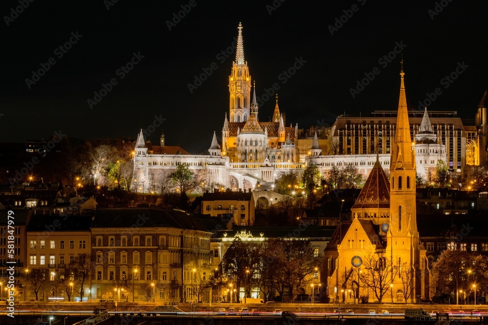 Illuminated Fisherman's Bastion at night above the Danube river in Budapest, Hungary
