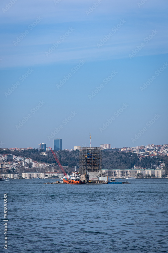 Fototapeta premium Restoration and renovation work, which started in 2022, continues on the Maiden's Tower, which is one of the iconic historical monuments of Istanbul and Turkey. Istanbul, Turkey, March 16, 2023