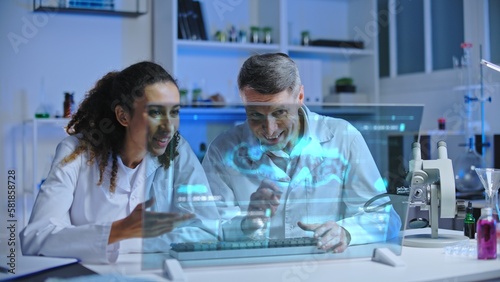 Two scientists satisfied with experiment results  looking at holographic screen